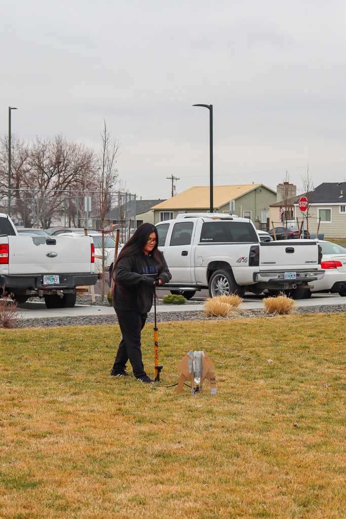 Student preparing to launch rocket