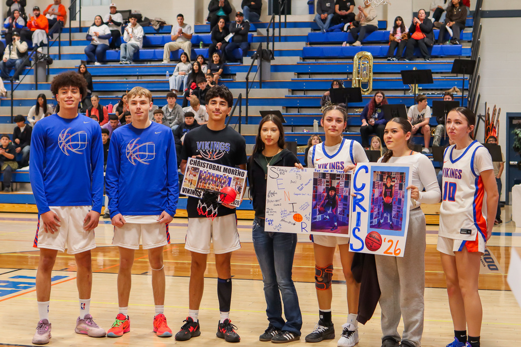 photo of basketball senior athlete with family and friends 