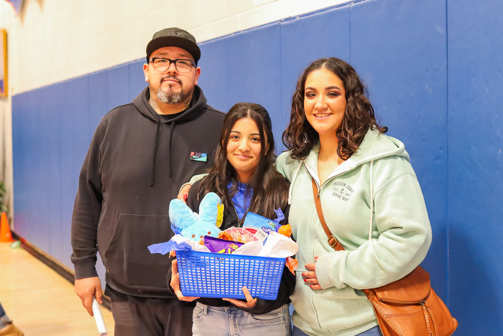 photo of cheer senior athlete with family 