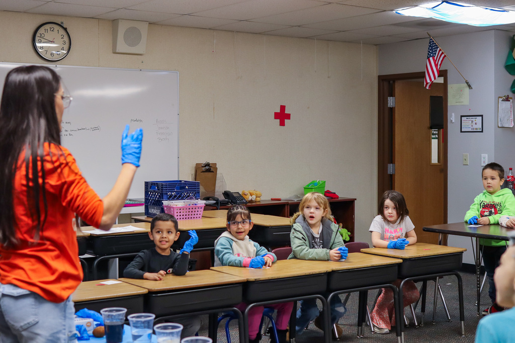 students being shown the results of one of the eggs