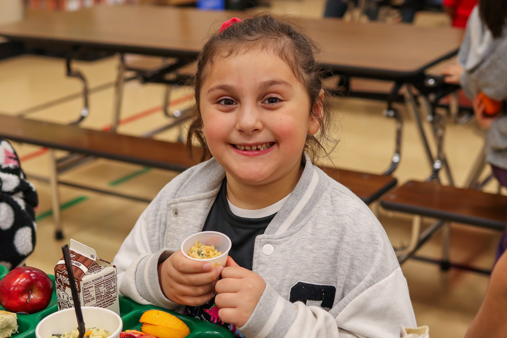 Photo of student with Mexican Street Corn sample