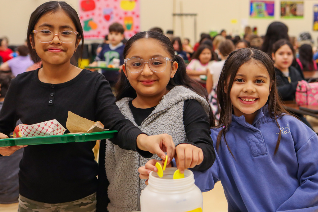 photo of students voting at the voting table