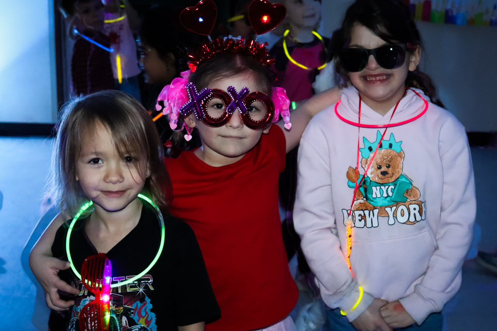 students with their glow accessories