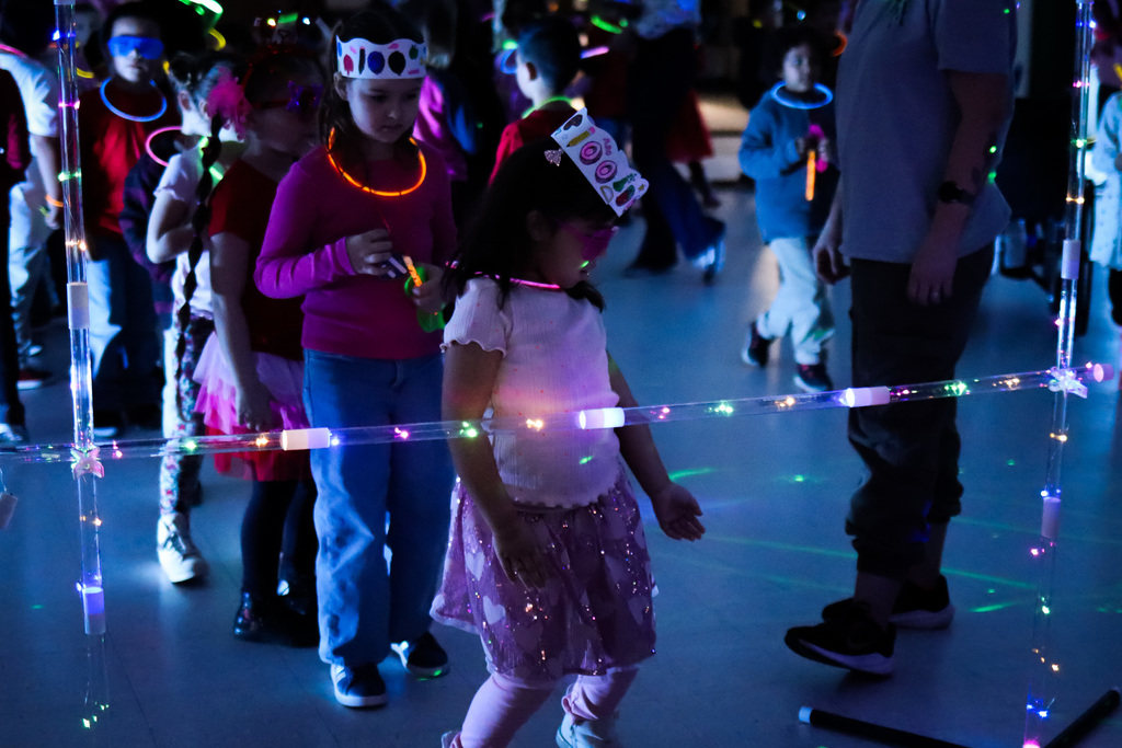 Students playing limbo 