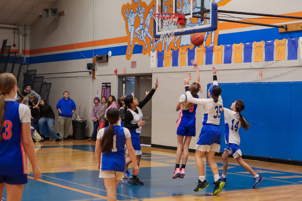 Athlete number 5 going in for a lay up