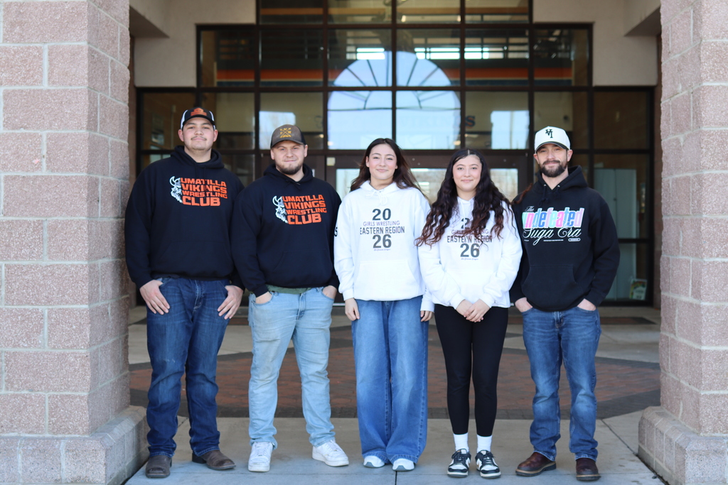Photo of Rylee with coaches and sister