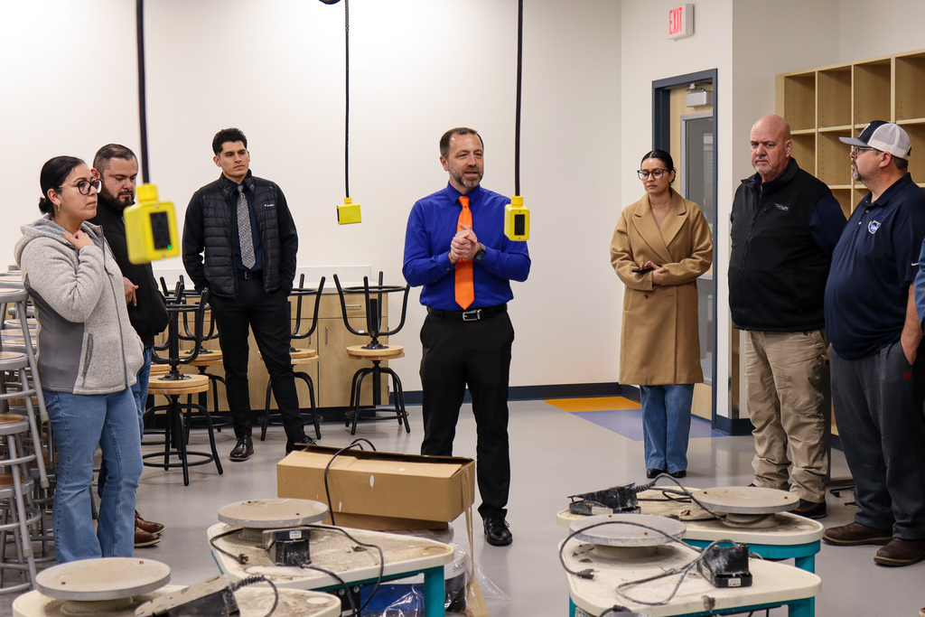 Photo of Principal Cotterell explaining the art room