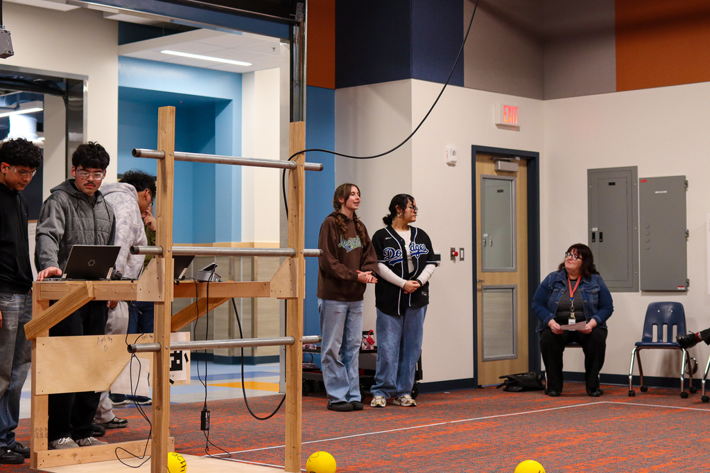 Photo of students explaining how they will utilize the field room