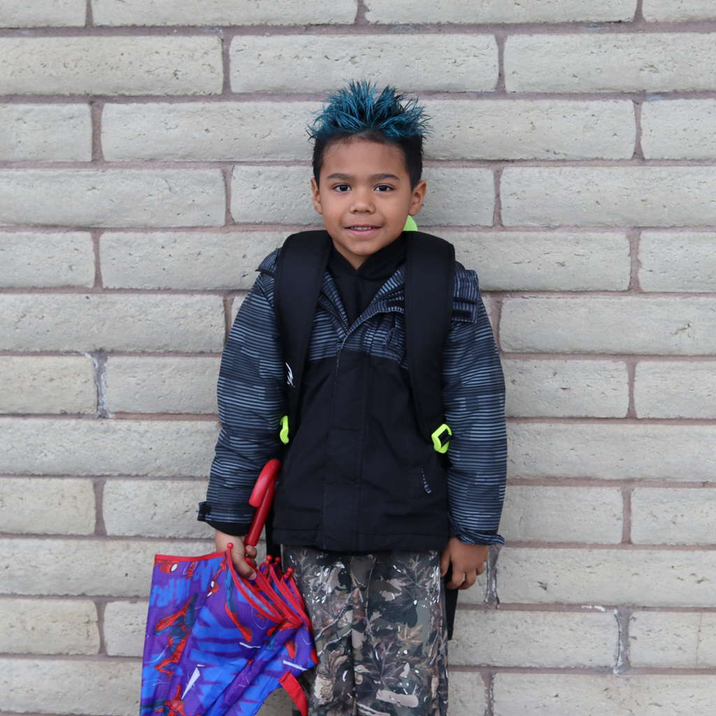 student with crazy hair