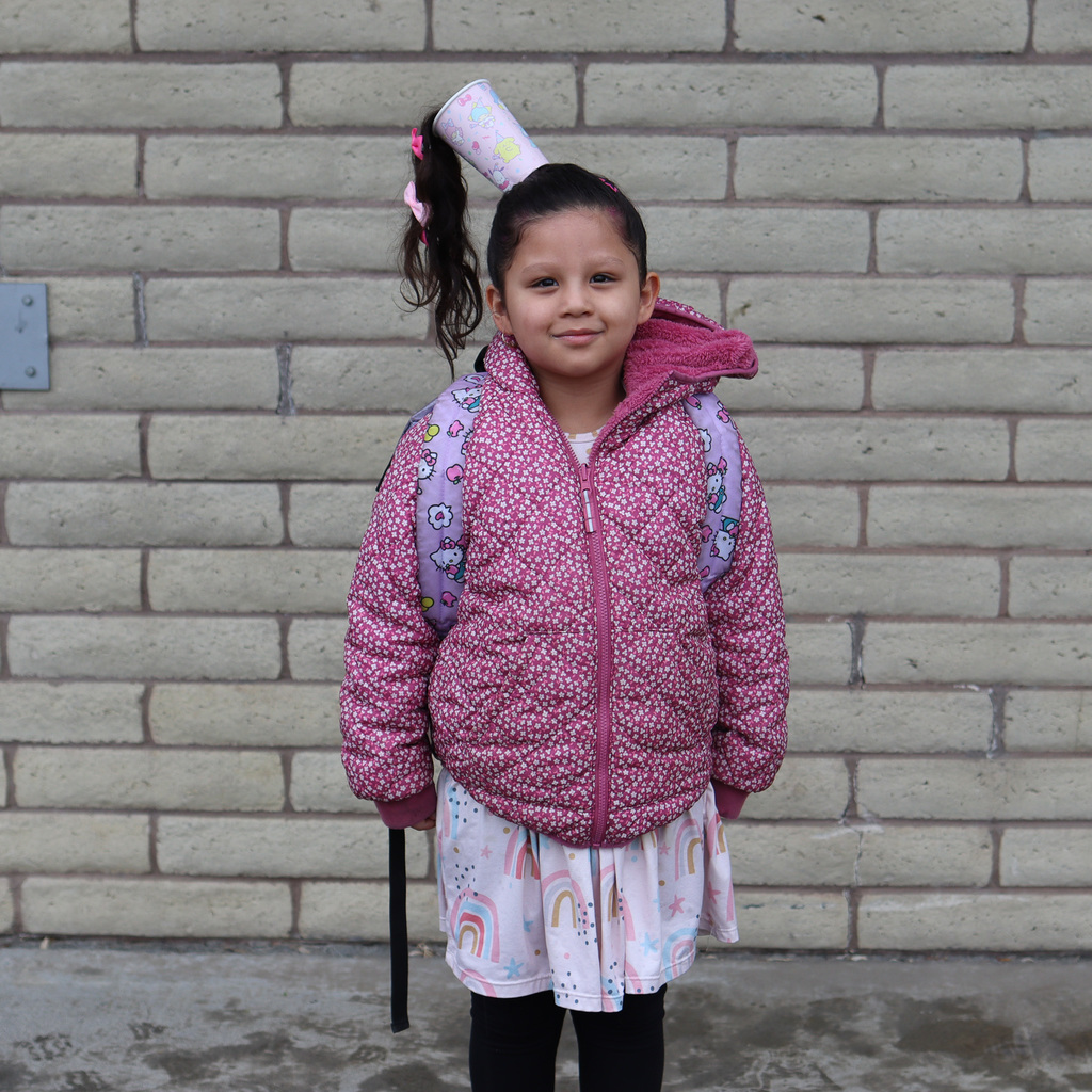 student with crazy hair