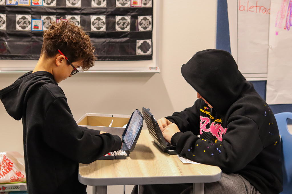 Students playing the board game battle ship