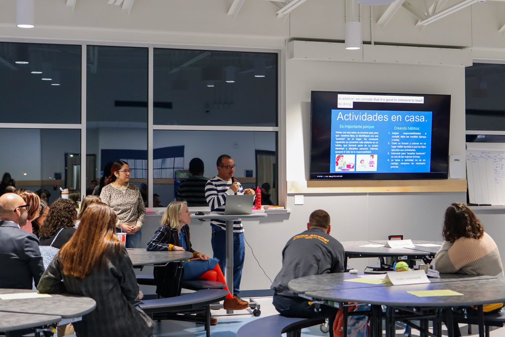 Teacher, Mr. Lemus sharing with families the importance of routines 