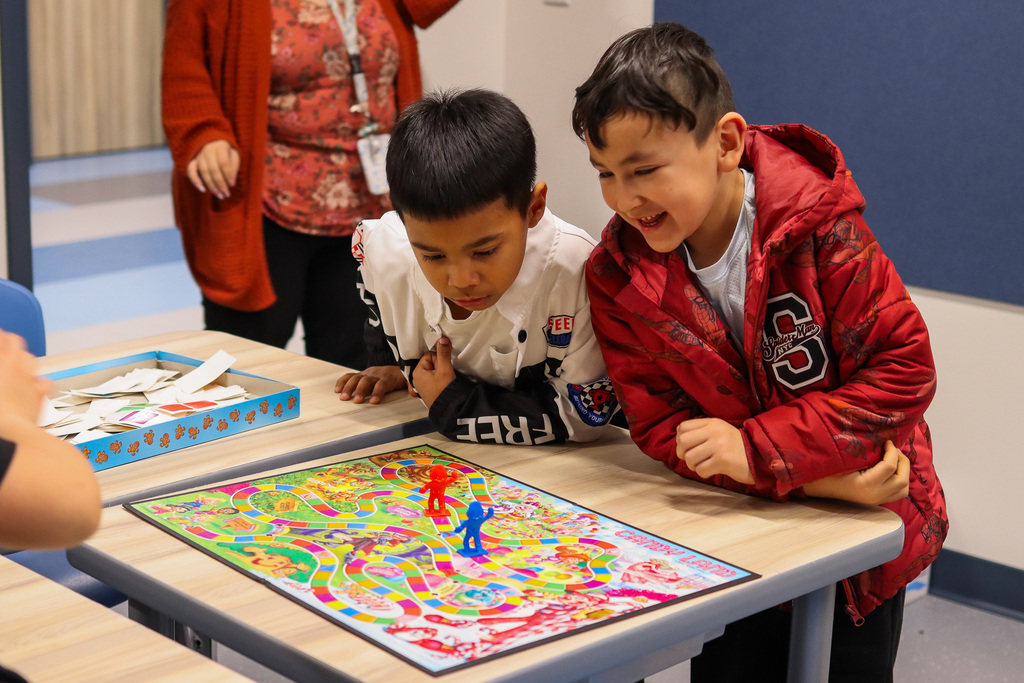 students playing the board game candy land