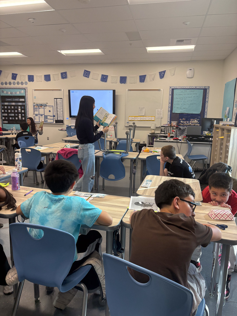 High School student reading to students