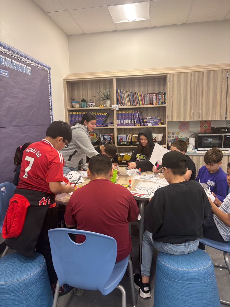 High school student reading to students