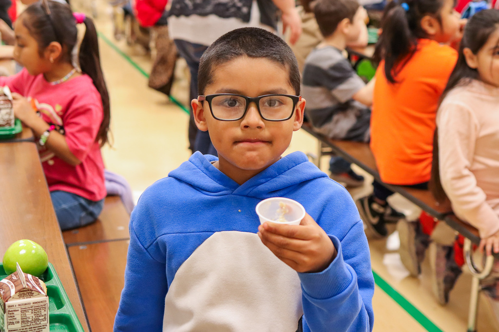 student holding up the oatmeal sample 