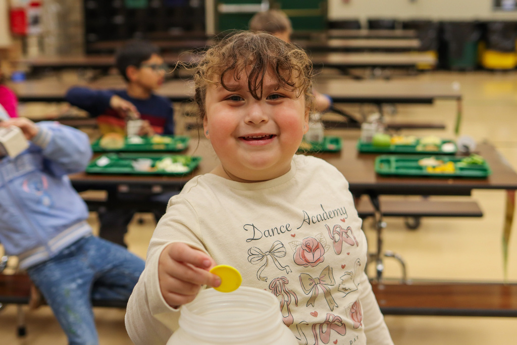 student voting at the voting table