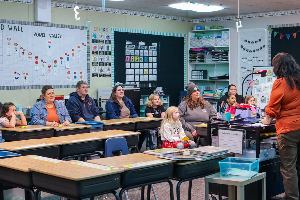 1st Grade teacher Mrs. Gutierrez reading to families 