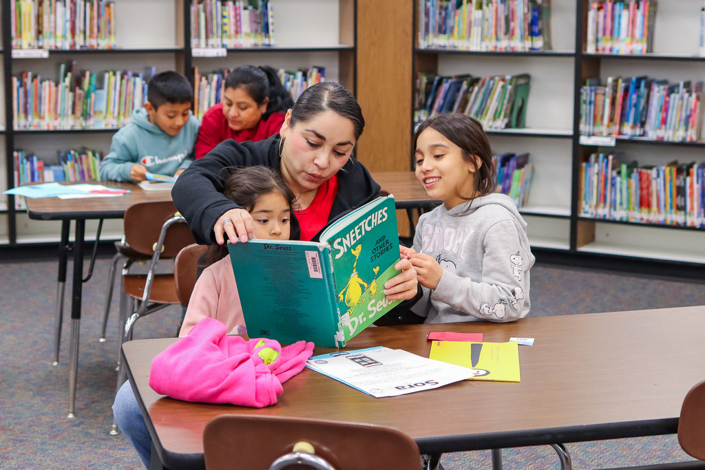 A family reading a book together