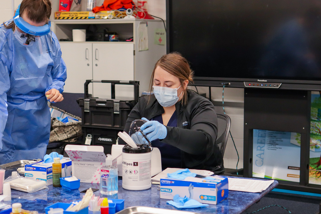 Dental hygienist getting supplies ready 