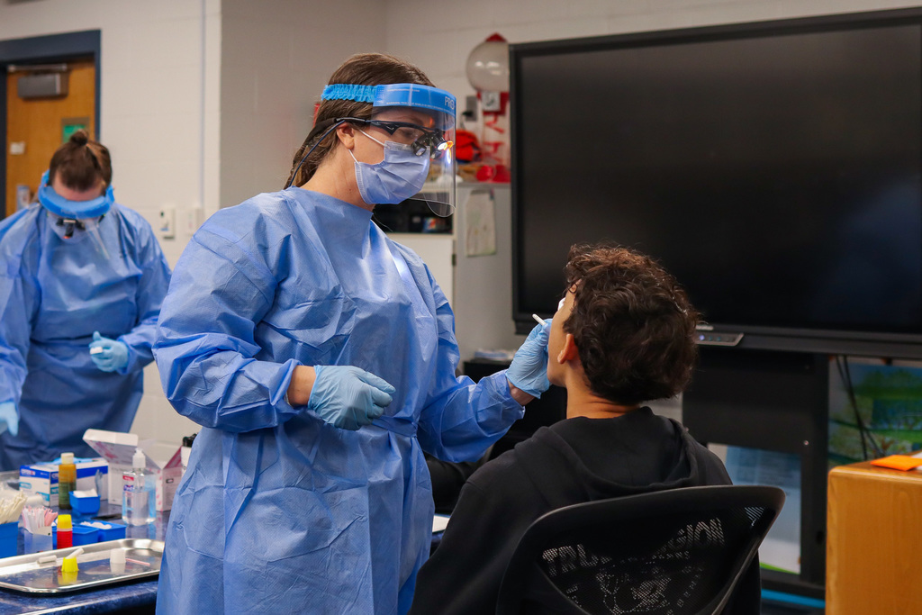 Photo of dental hygienist working on student's teeth 