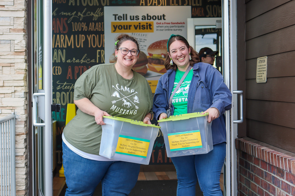Principal Coyle and Vice Principal Lorence greeting families at door 