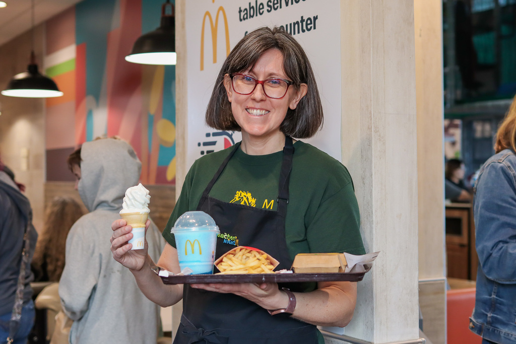 Mrs. Enkey holding tray of food 