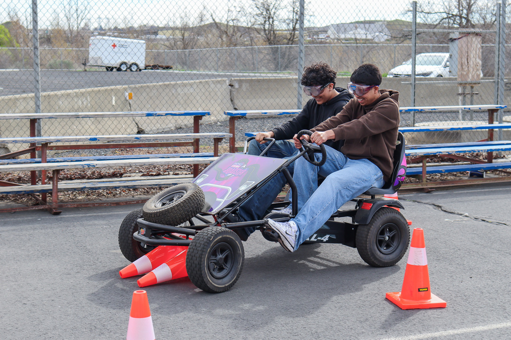 students steering the pedal bike