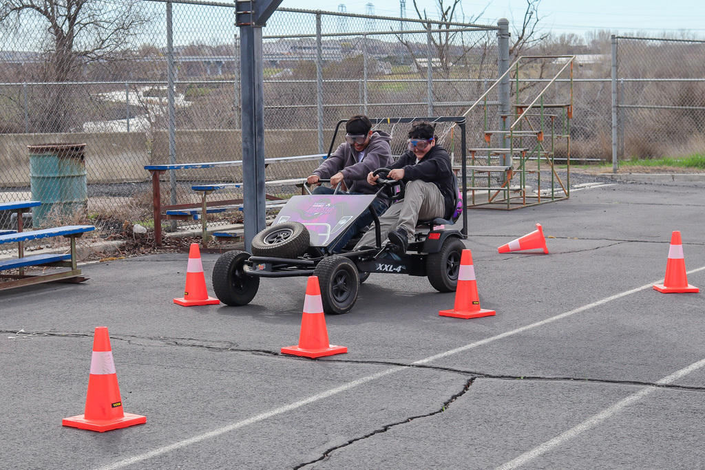 photo of students steering the pedal bike 