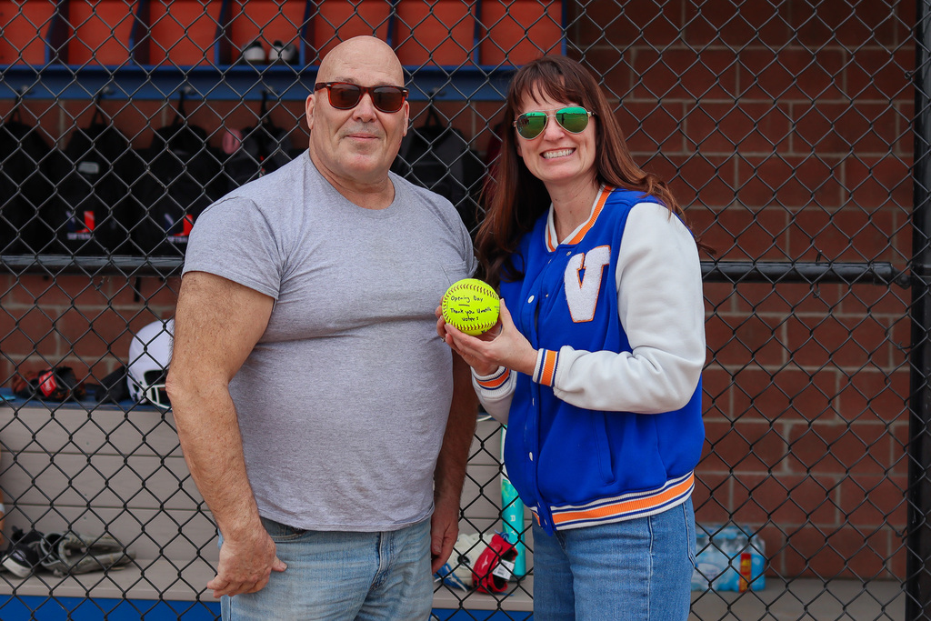 Board member Steve Warr and Superintendent Heidi Sipe with ceremonial ball that says Opening Day Thank you Umatilla Voters