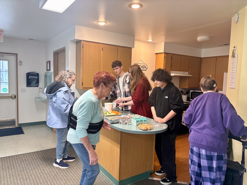 Senior residents in line to get their meal