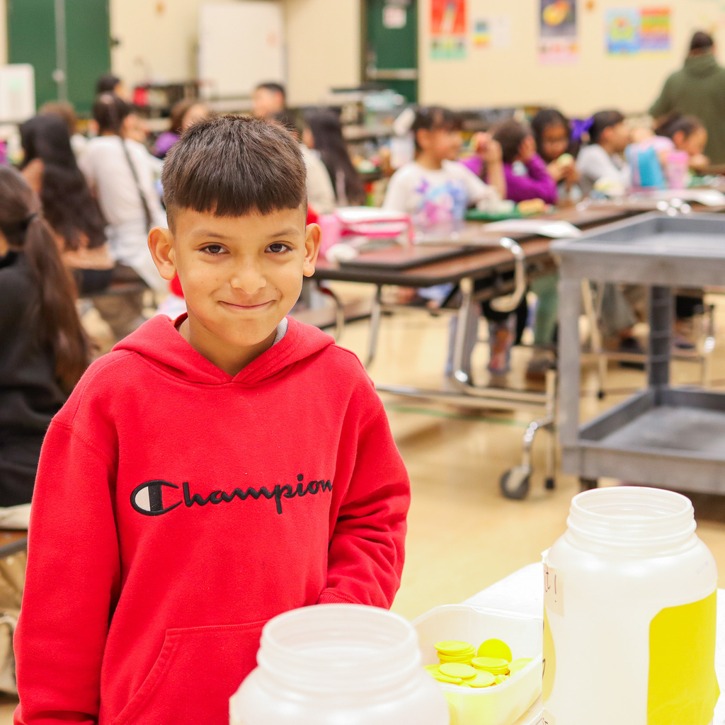 student at the voting table 