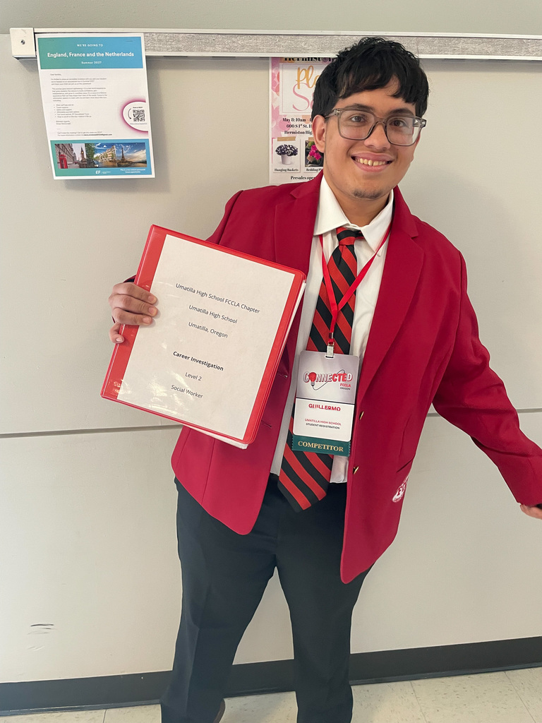 Sophomore Guillermo with his Career Investigation Binder 