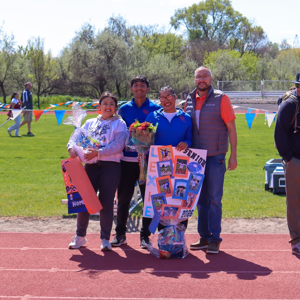 Senior pictured with their family 