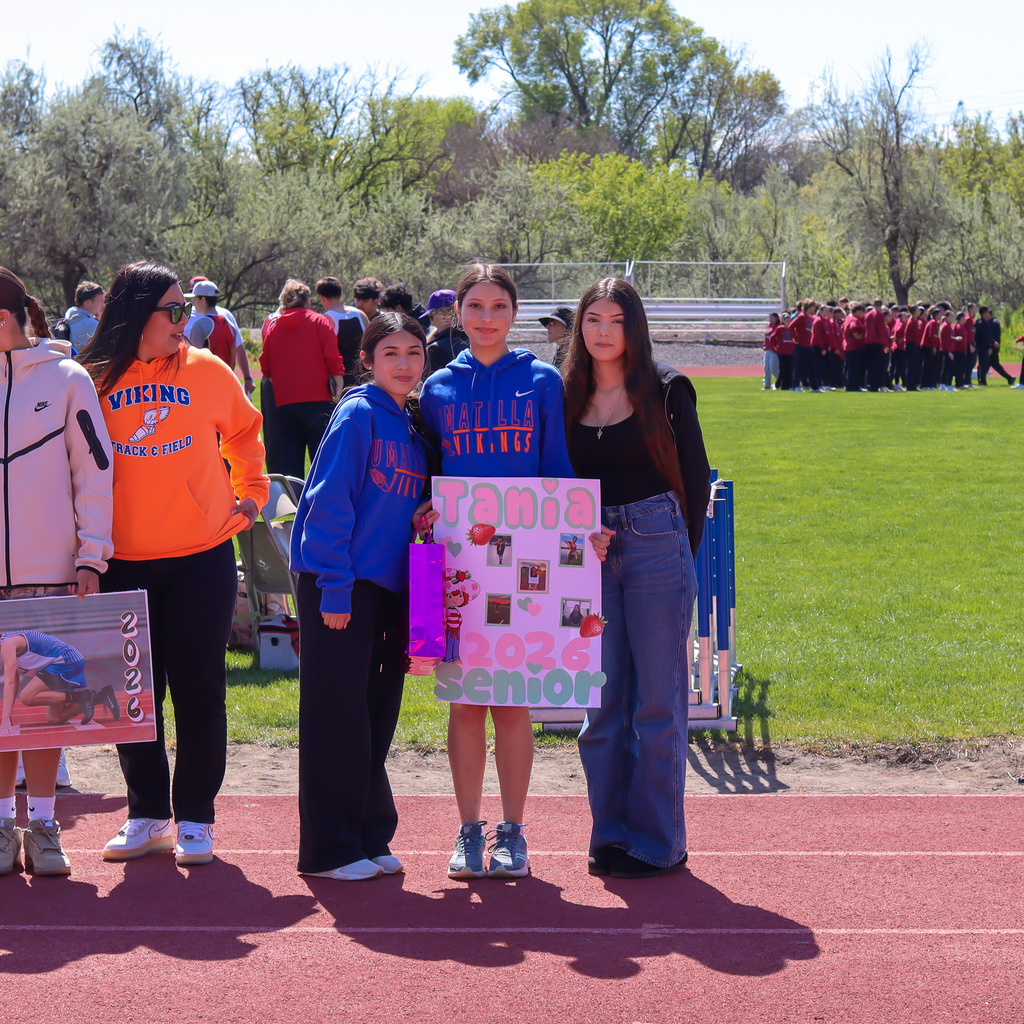 Senior pictured with their family 