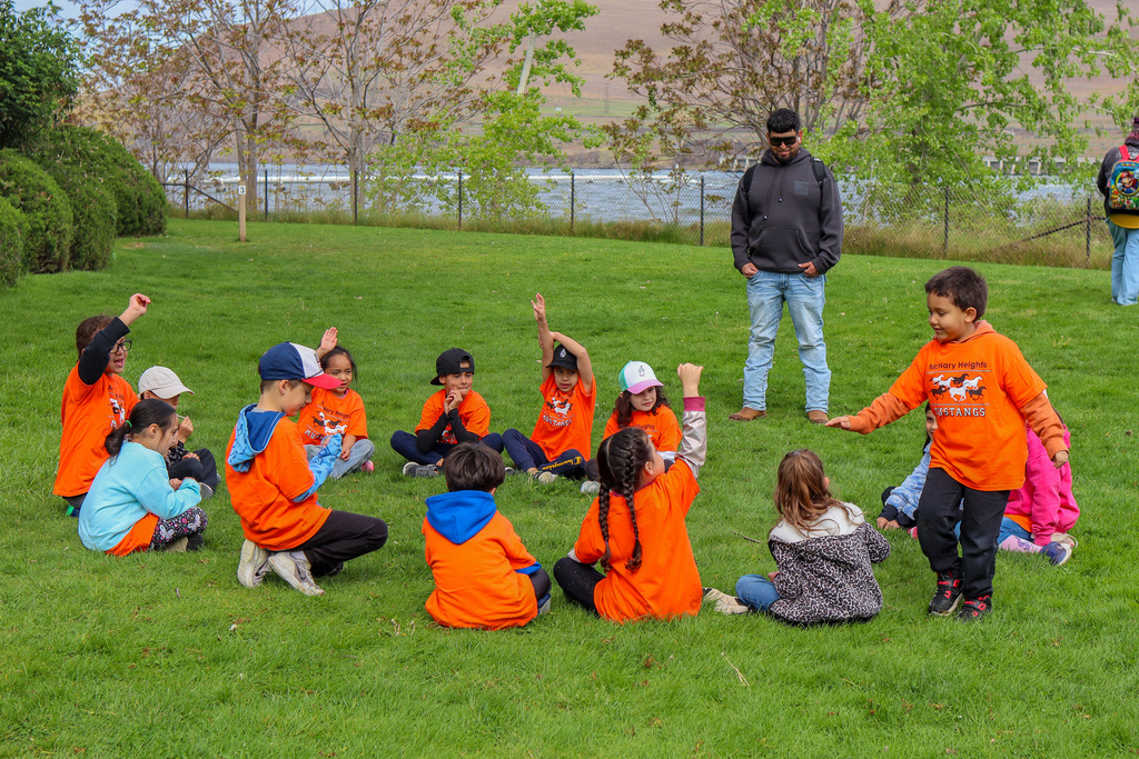 students playing Duck Duck Goose 