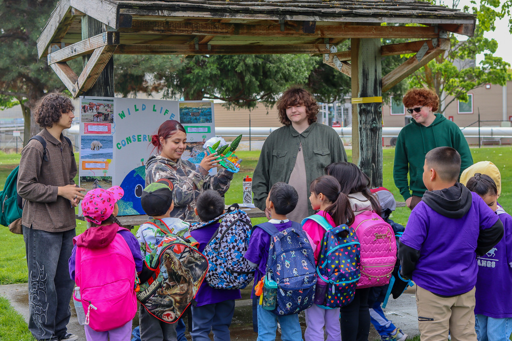 high school students presenting to MHES students about wildlife conservation 