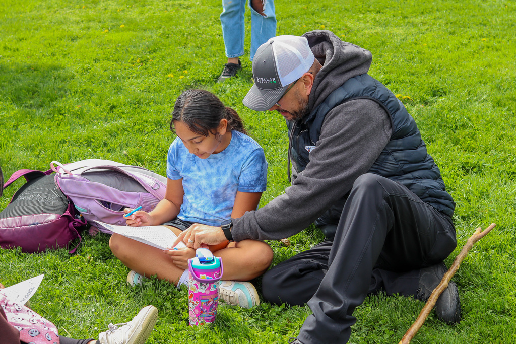 student and parent filling out word search 