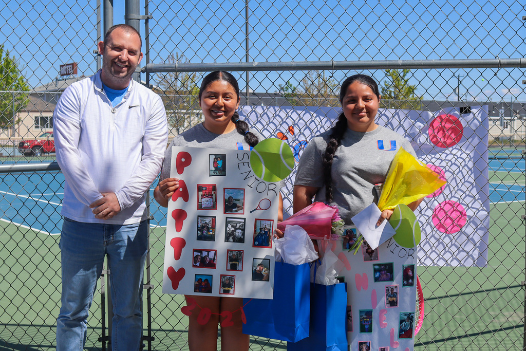 photo of senior girl tennis athletes with coach
