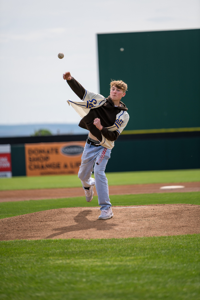 Photo of senior throwing out first pitch