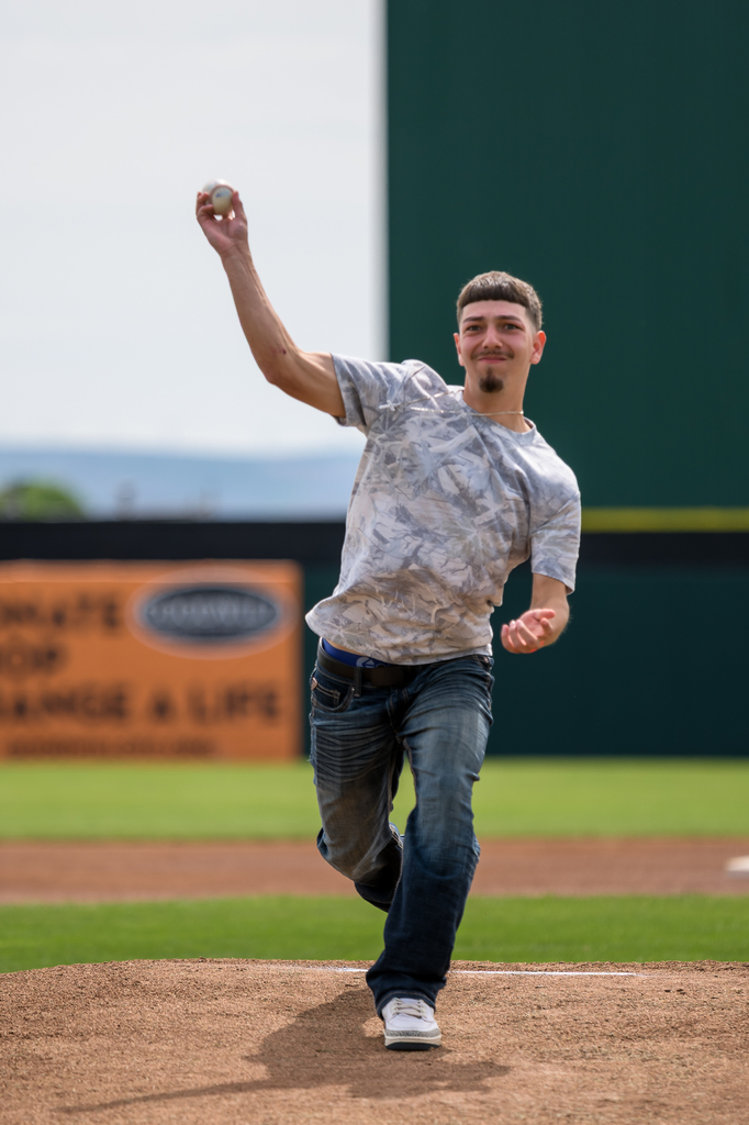 Photo of senior throwing out first pitch