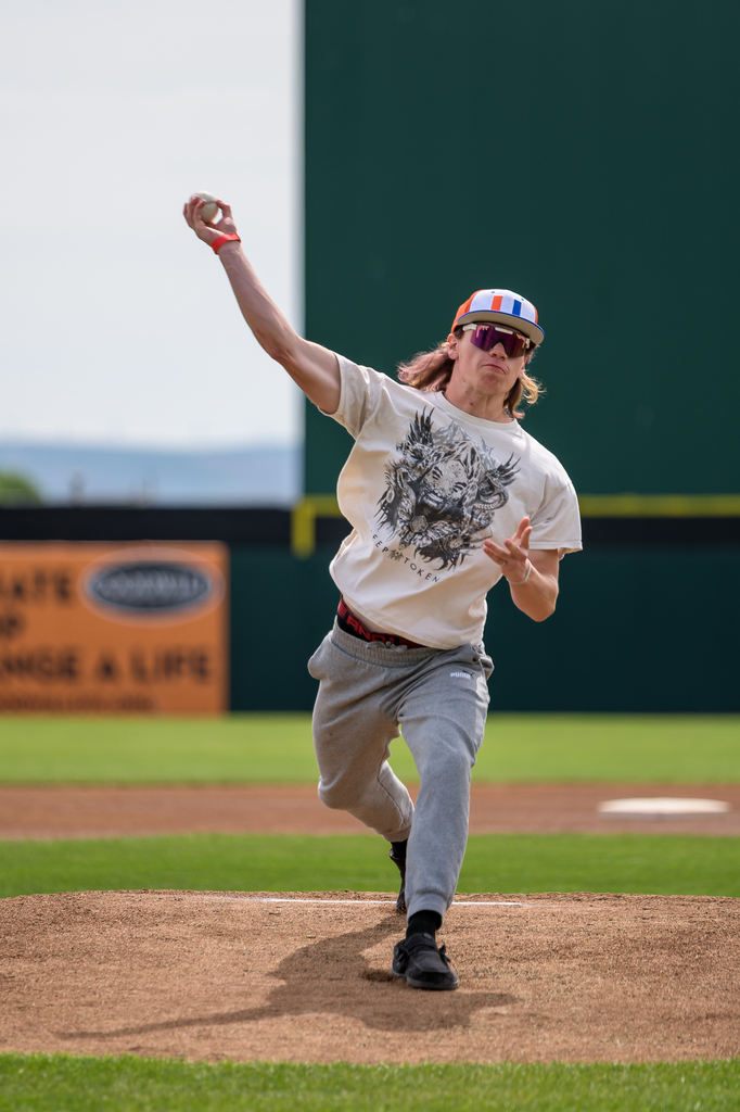 Photo of senior throwing out first pitch