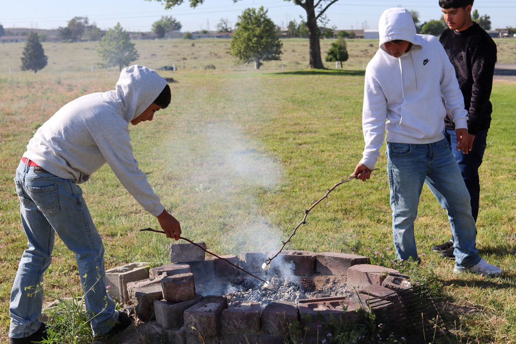 students roasting marshmallows 
