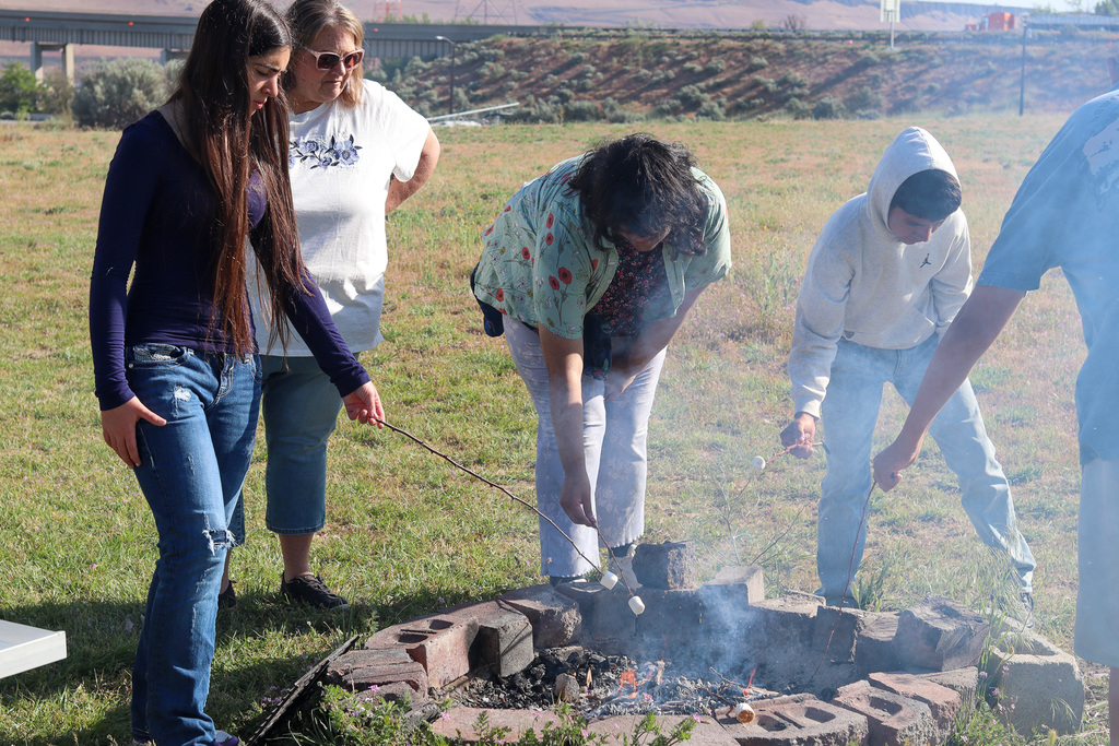 Students roasting marshmallows 