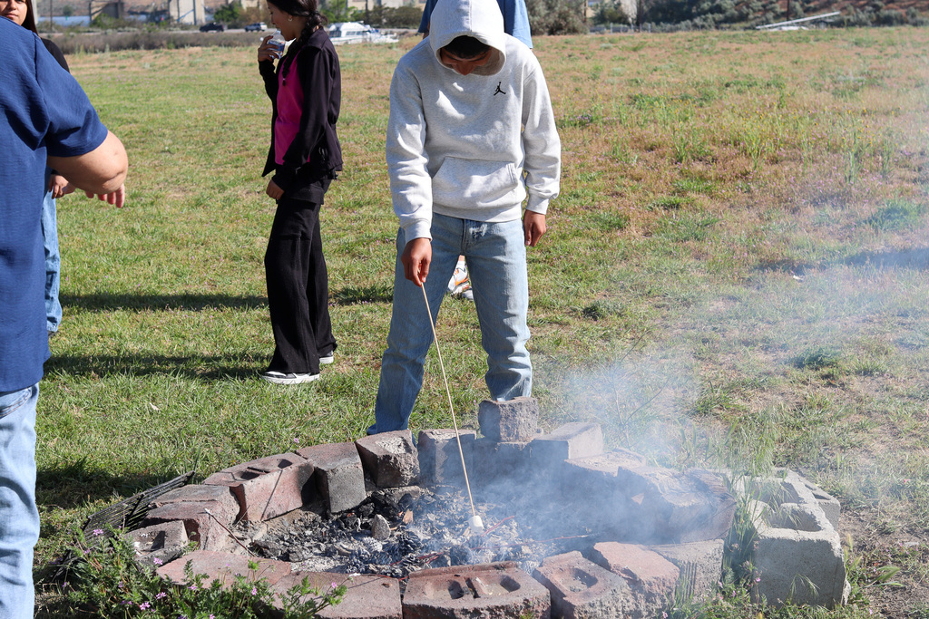 student roasting a marshmallow 