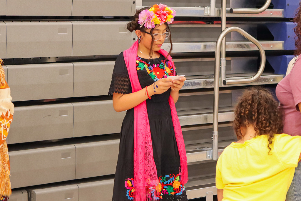 Student presenting their speech to family 