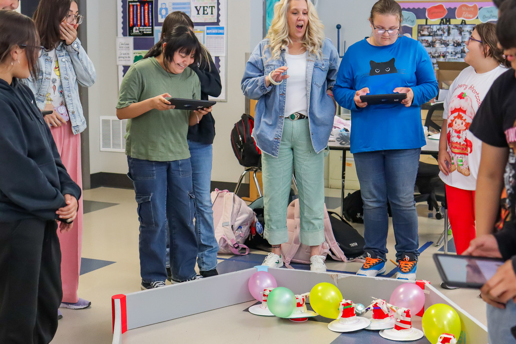 students driving their battle bots