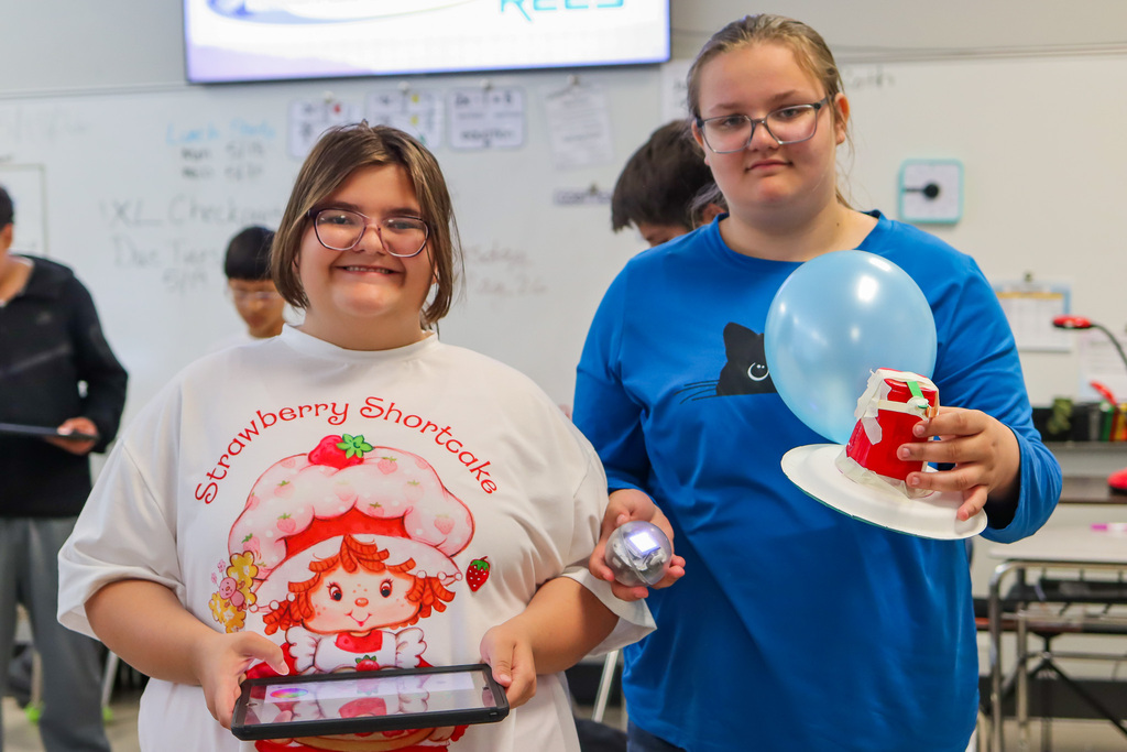 photo of students with their finished battle bot
