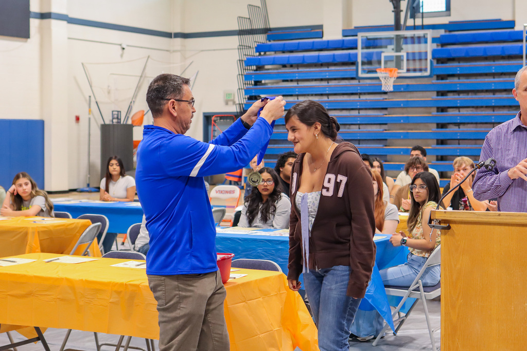 Senior being awarded a medal for earning the Seal of Biliteracy
