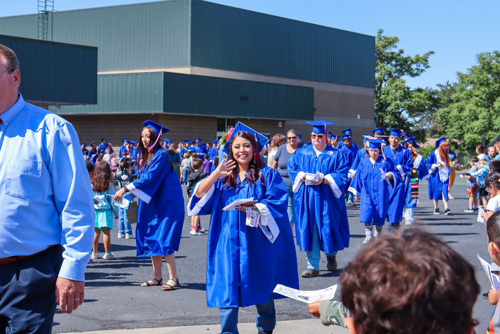 Senior waving at the camera as they participate in the senior memory walk at McNary Heights Elementary
